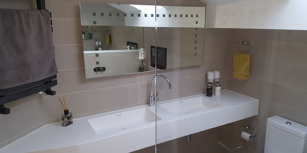 Bathroom with twin sinks and electric mirror